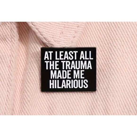 AT LEAST ALL THE TRAUMA MADE ME HILARIOUS Black Enamel Pin NEW - Picture 1 of 3